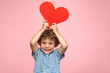 Leinwandbild Motiv Charming kid posing with heart