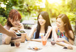 © Tom Wang - young woman paying bill with smart phone in restaurant