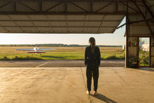 Woman Posing Inside Of Hangar