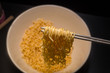 © niphon - A instant noodles  top view  clean background