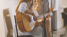 Woman With Guitar At Stage In Loft