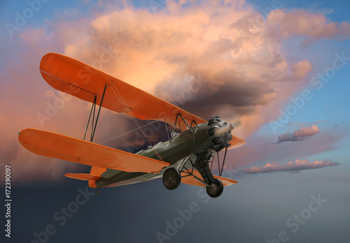 Fotografering  Old biplane in flight