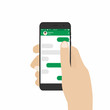 © Yevhenii - Messenger and social network concept. Hand holding smartphone with blank template messeges