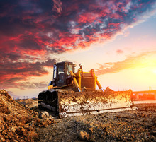 Bulldozer On A Building Site At Sunset
