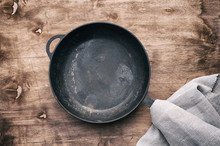 Empty Round Black Cast-iron Frying Pan