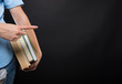 © Catalin Pop - Closeup view of student female holding books