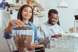 © zinkevych - Cheerful new baristas training their coffee-making art