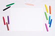© photka - Blank piece of paper with colorful crayons on kid's desk, top view with copy space