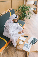 Poster - muslim businessman sitting on sofa