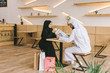 © LIGHTFIELD STUDIOS - muslim couple spending time in cafe