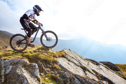 Cuadros en Lienzo A man is riding enduro bicycle.