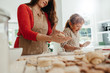 © Jacob Lund - Mother and child making cookies for Christmas.