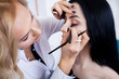 © Maksymiv Iurii - Make-up artist preparing beautiful bride for ceremony in a morning