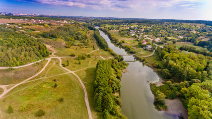 Wall Mural - Beautiful view of the forest and the river in the city. Aerial view.