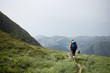 © Miquel Llonch/Stocksy - Young backpacker in a high trail of the Pyrenees