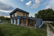 © Aleksandar Novoselski/Stocksy - Exterior view of multiple story modern house