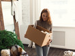 © Milles Studio/Stocksy - Woman decorating her home