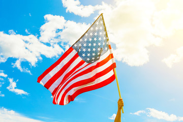 Wall Mural - USA flag with clouds on background