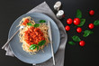 PLate of delicious pasta with bolognese sauce on table
