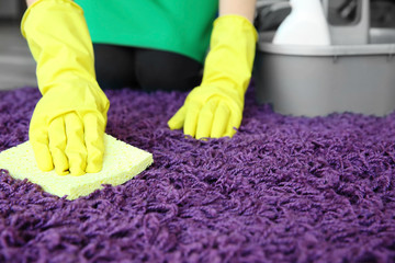 Wall Mural - Woman cleaning carpet in room