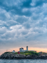 Nubble Lighthouse With A Cloudy Sunrise