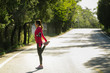 © Maa Hoo/Stocksy - Young woman doing workout before jogging