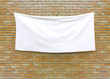 Leinwandbild Motiv Cloth banner hanging on brick wall. 3D illustration