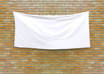 Cloth banner hanging on brick wall. 3D illustration