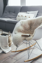 Wall Mural - Rocket chair with sheep skin rug in scandinavian living room