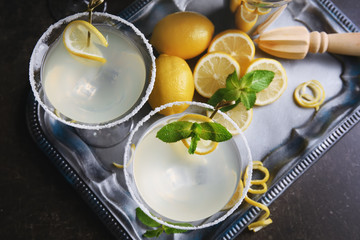 Canvas Print - Glasses of lemon drop martini on metal tray