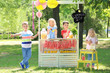 © Africa Studio - Happy children making lemonade at stand in park