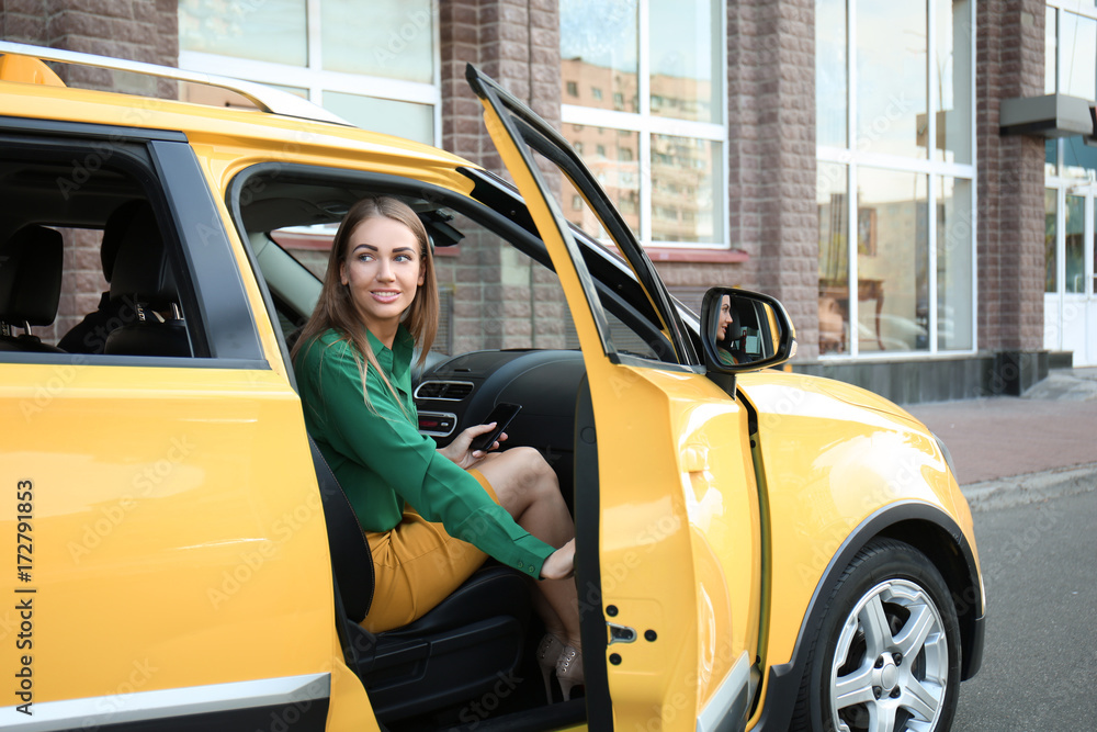 Young woman in taxi car