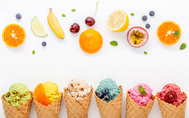 Fototapete - Various of ice cream flavor in cones blueberry ,strawberry ,pistachio ,almond ,orange and cherry setup on white wooden background . Summer and Sweet menu concept.