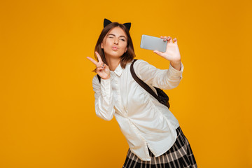 Poster - Cheerful teenage schoolgirl in uniform with backpack