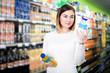 © JackF - female shopper searching for beverages