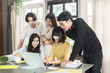 © gballgiggs - Diversity group of young student people discuss in meeting room