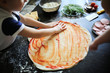 © natalialeb - boy prepares pizza with tomato paste,real interior