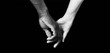 © Curto - A hands of black man and white woman on black background