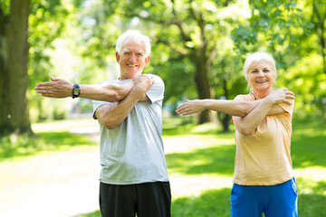 Wall Mural - Senior Couple Exercising In Park
