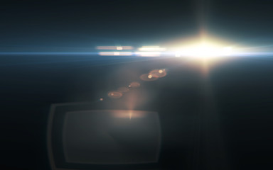 Wall Mural - digital lens flare in black background.beautiful rays of light.natural flare with dust on space