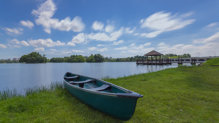  Scenery of Beautiful Cloud with Colorful Canoes Rests on a Shore.