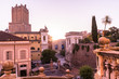 © peizais - Ancient Roman constructions seen from the stairs of the church of Santo Domenico and Sisto with the sun backlit at dusk in Rome, Italy