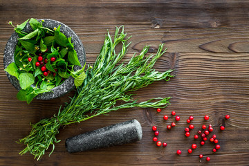 Poster - close up of ingredients for making spices and herbs in mortar wooden background top view