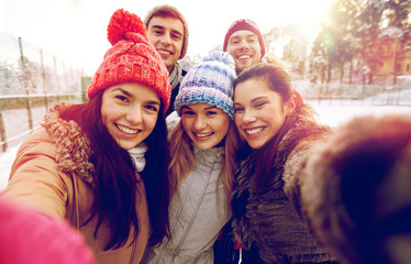 Wall Mural - happy friends taking selfie with smartphone