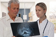 © dream@do - Doctor and patient dentist looking at x-ray. Health care and medical concept.