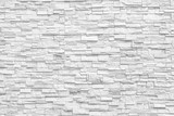 Fototapeta Desenie - Surface white wall of stone wall gray tones for use as background. The new design of modern stone wall. pattern of decorative stone wall surface.