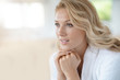 © goodluz - Portrait of beautiful 40-year-old woman relaxing in bathrobe at home