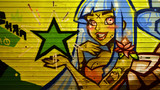 Fototapeta Młodzieżowe - The texture of the wall, decorated in graffiti drawing with the image of a pretty girl with blue hair