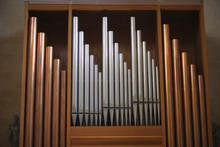 Copper And Silver Organ Pipes In The Catholic Basilica. Lecce, Italy.