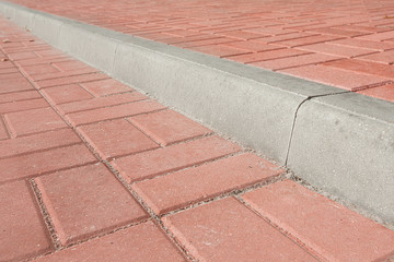 road divided by a concrete curb